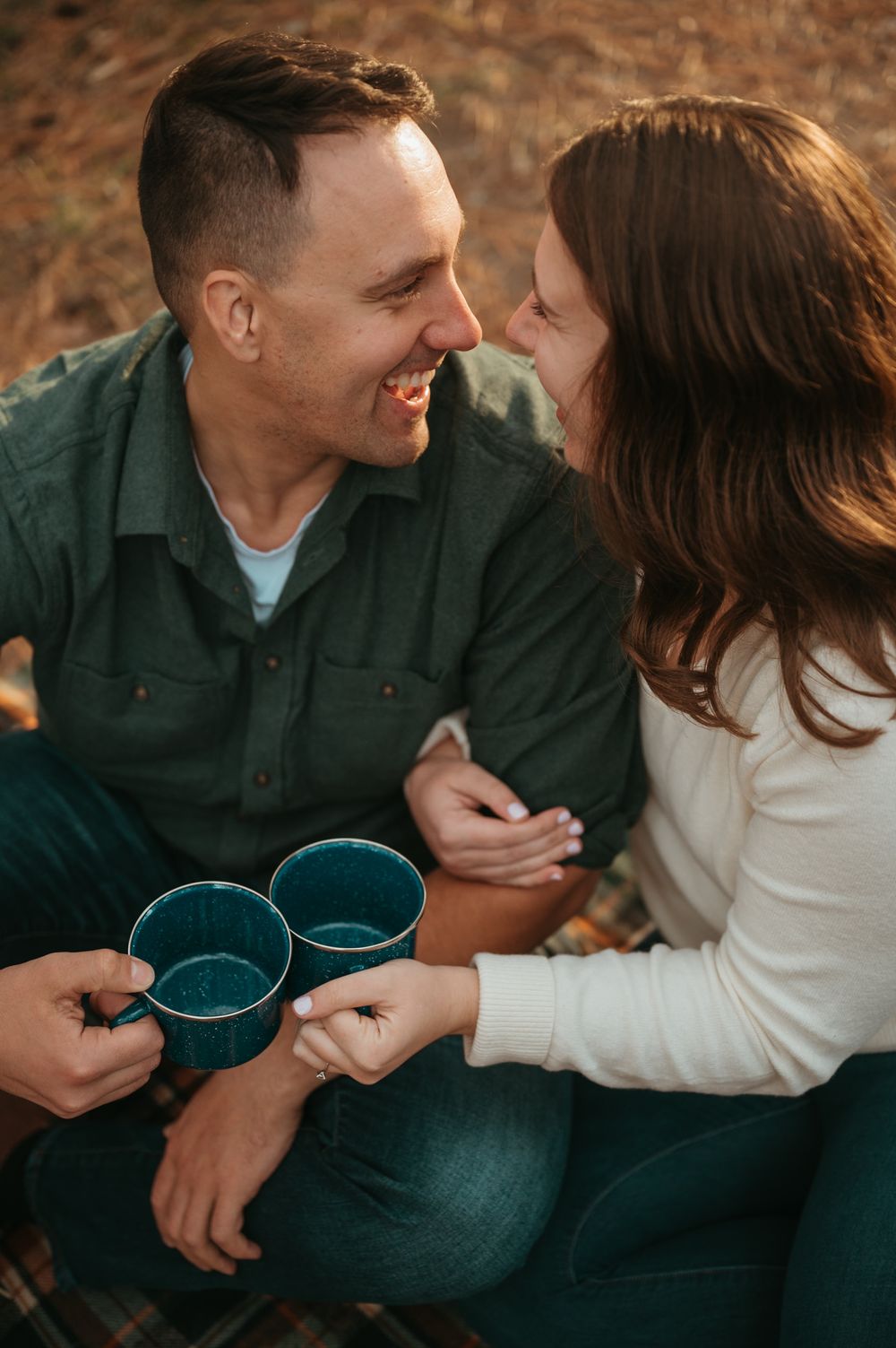 Couple sharing a romantic moment with blue bowls in a cozy indoor setting with warm autumn tones.