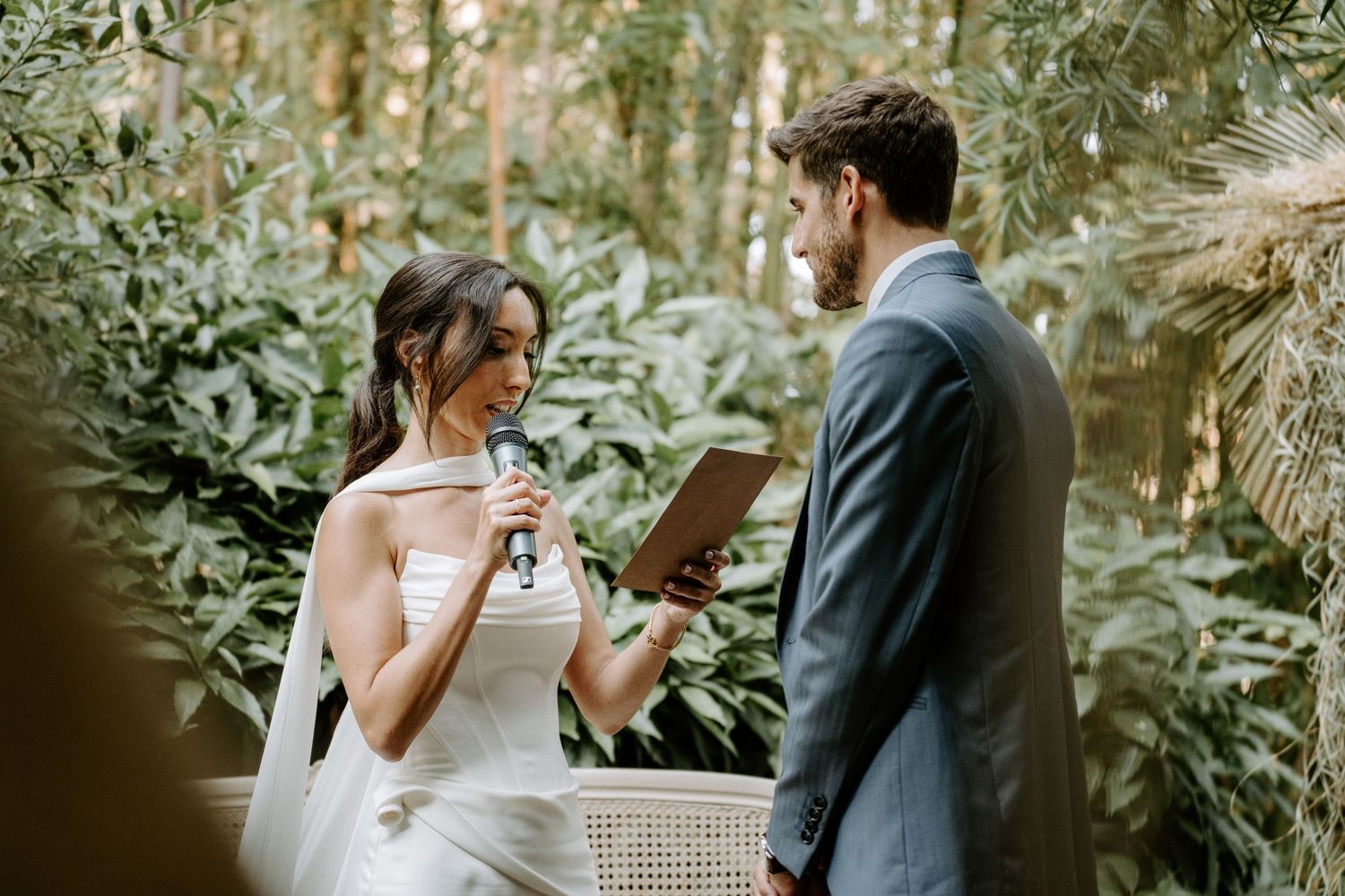 Intimate garden wedding ceremony moments captured among natural greenery.
