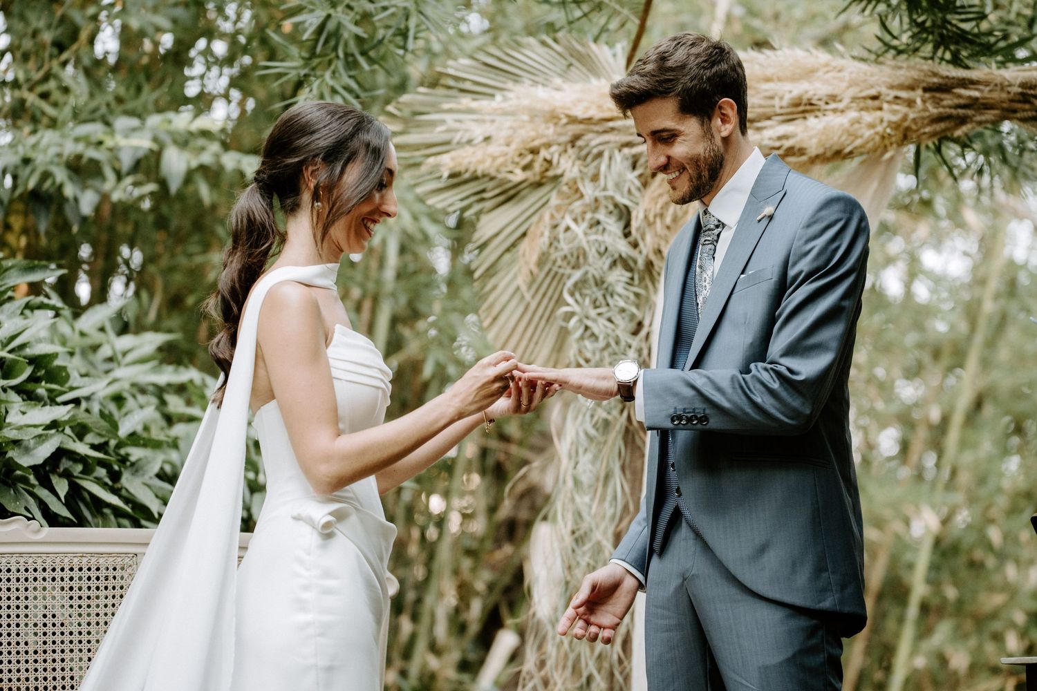 Romantic wedding photo session in a serene garden with vintage furniture.