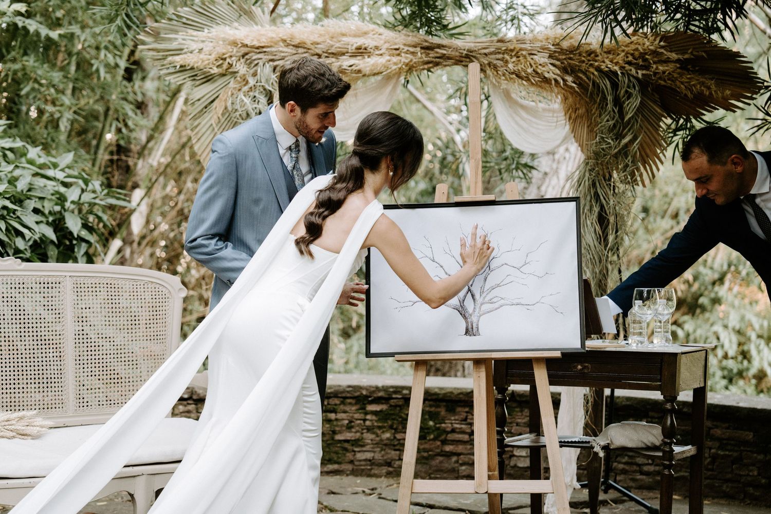 Wedding couple sharing tender moments in a natural garden setting.