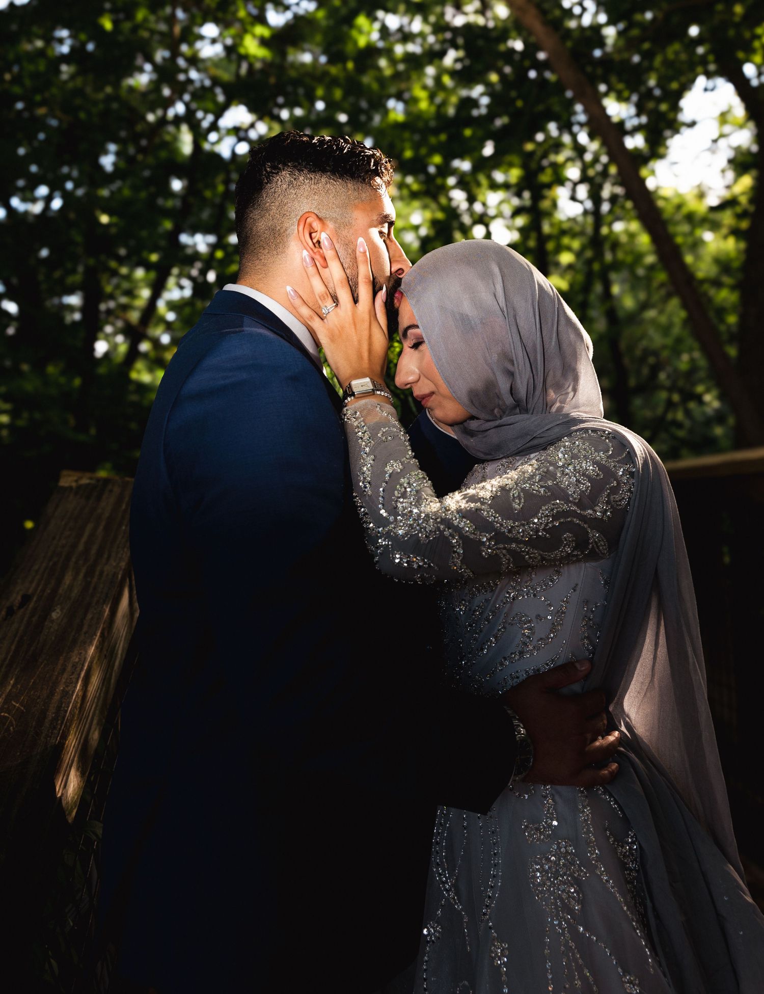 Romantic couple sharing intimate moments in a series of sunset garden photos with dramatic lighting and silhouettes.