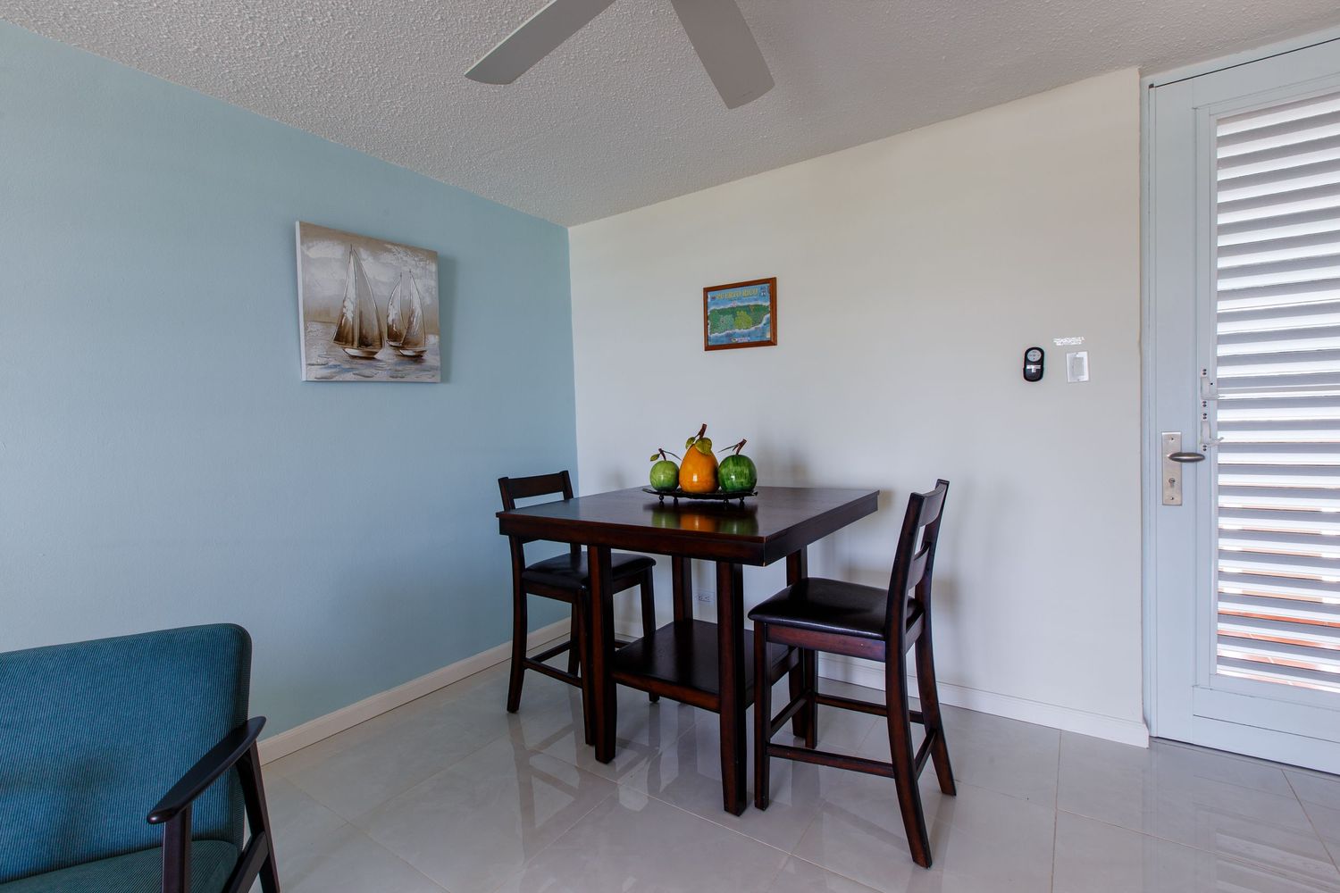 Real estate photography. Dining room. Short-term rental in Playa Azul Tower 1 in Luquillo, Puerto Rico.