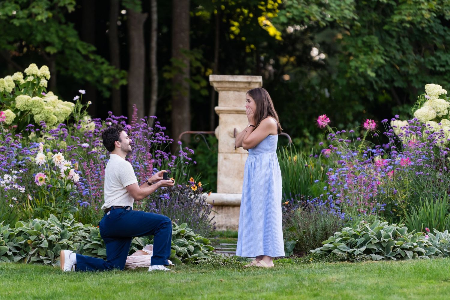 Romantic Rhode Island engagement portraits in garden landscape.
