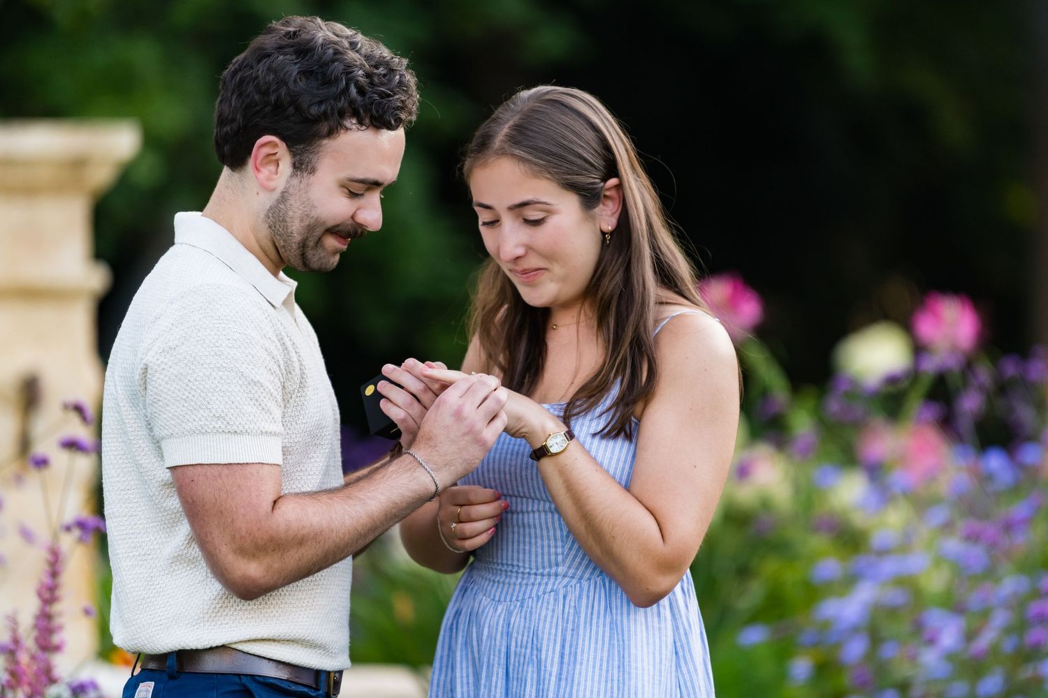 Outdoor engagement portraits with flowers in Rhode Island.