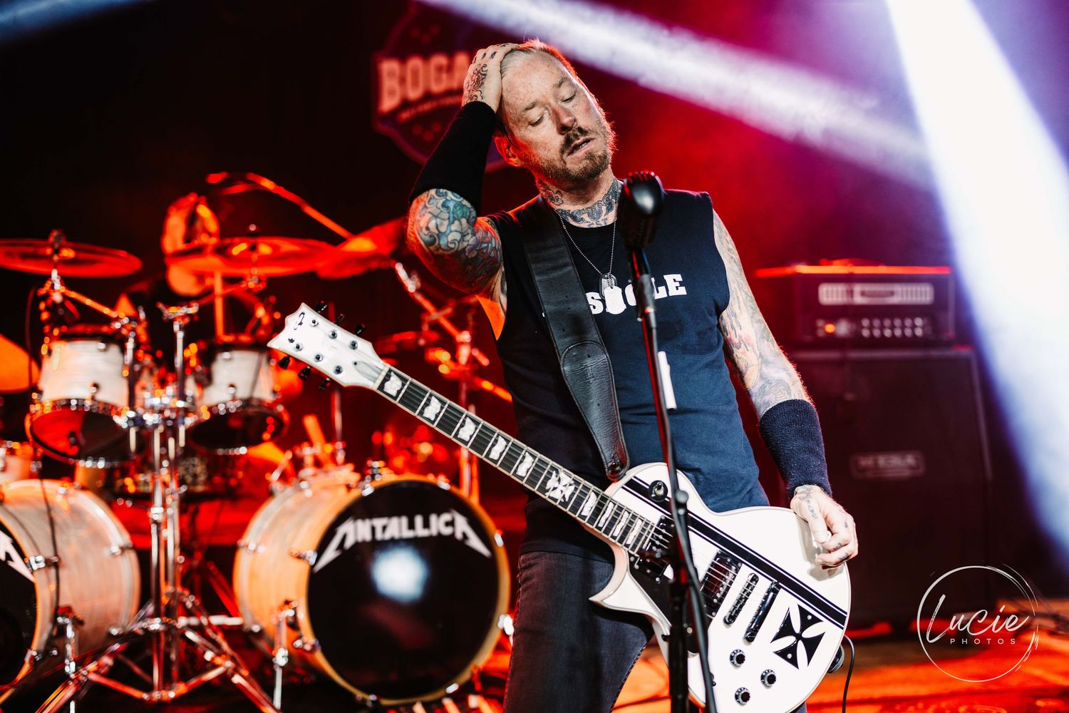 A collection of vibrant concert photos showing guitarists and drummers performing on stage with dramatic lighting.