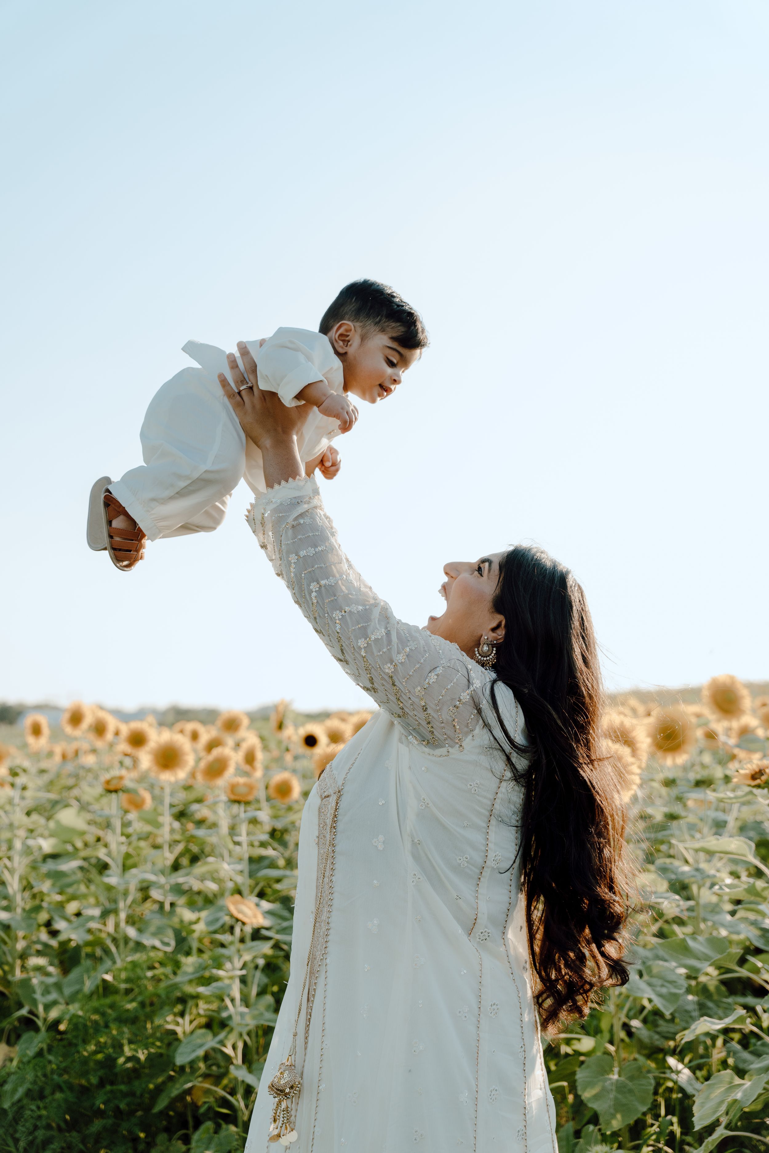 Lifestyle family photography focused on natural interaction, movement, and real moments between parents and children at burnside farms
