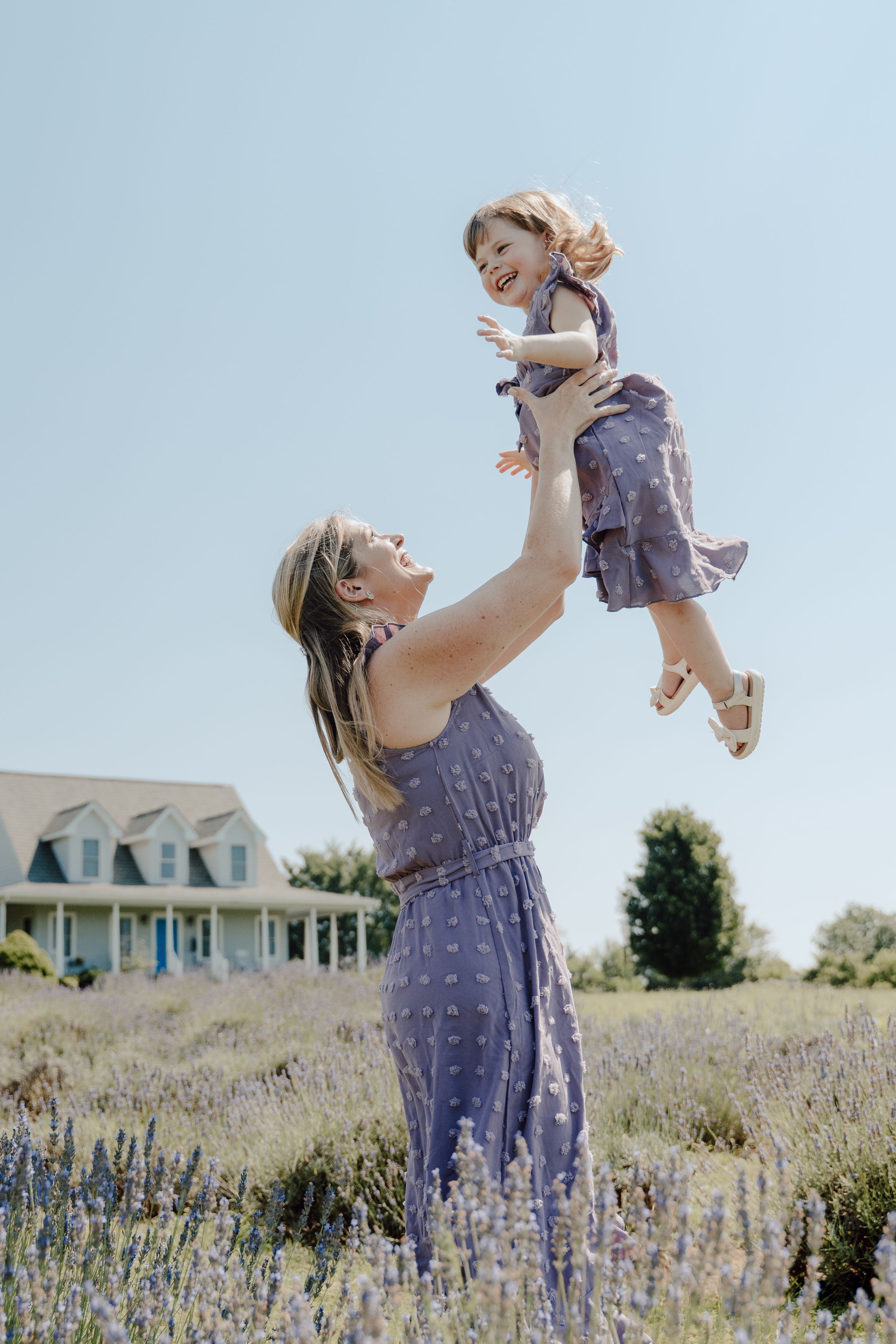 Lifestyle family photography focused on natural interaction, movement, and real moments between parents and children.