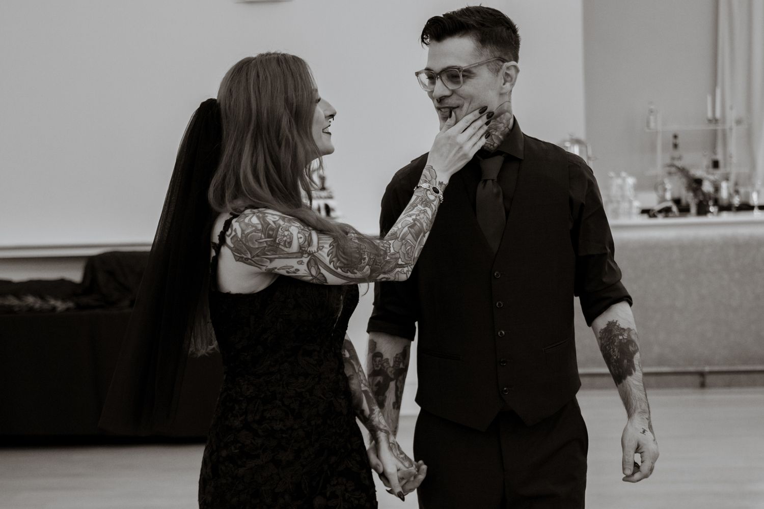 Black and white sequence showing a couple interacting in casual poses.