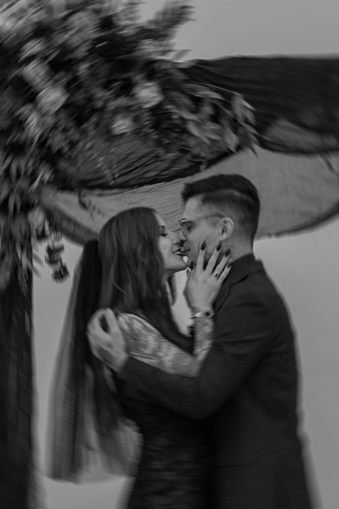 Dramatic black and white sequence showing an intimate couple's photoshoot.