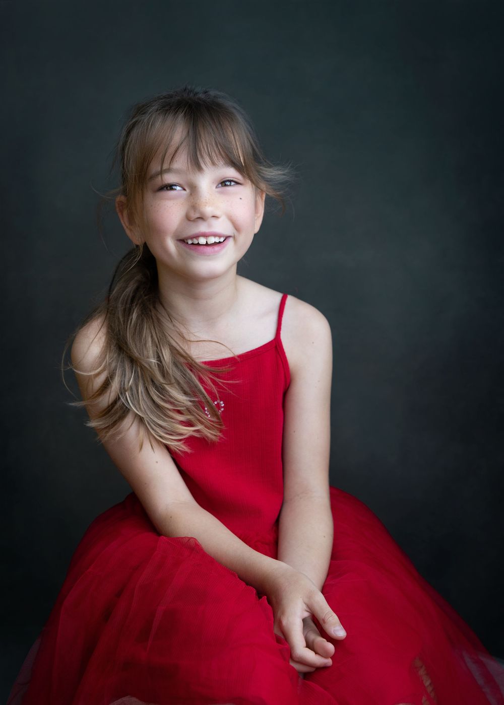 Best Hong Kong family photographer Christmas photo shoot portrait of a girl in red
