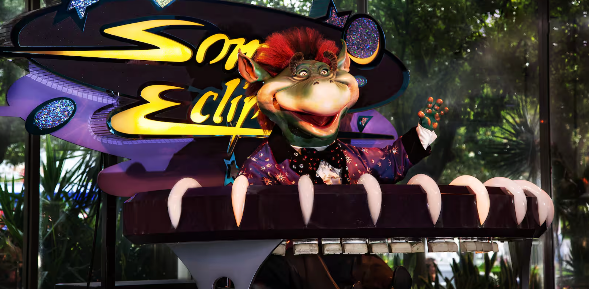 Sonic Eclipse sign displayed on colorful amusement park ride attraction with neon-style lettering.