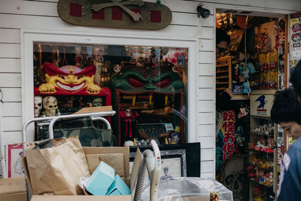 Storefront display with various merchandise and decorative items.