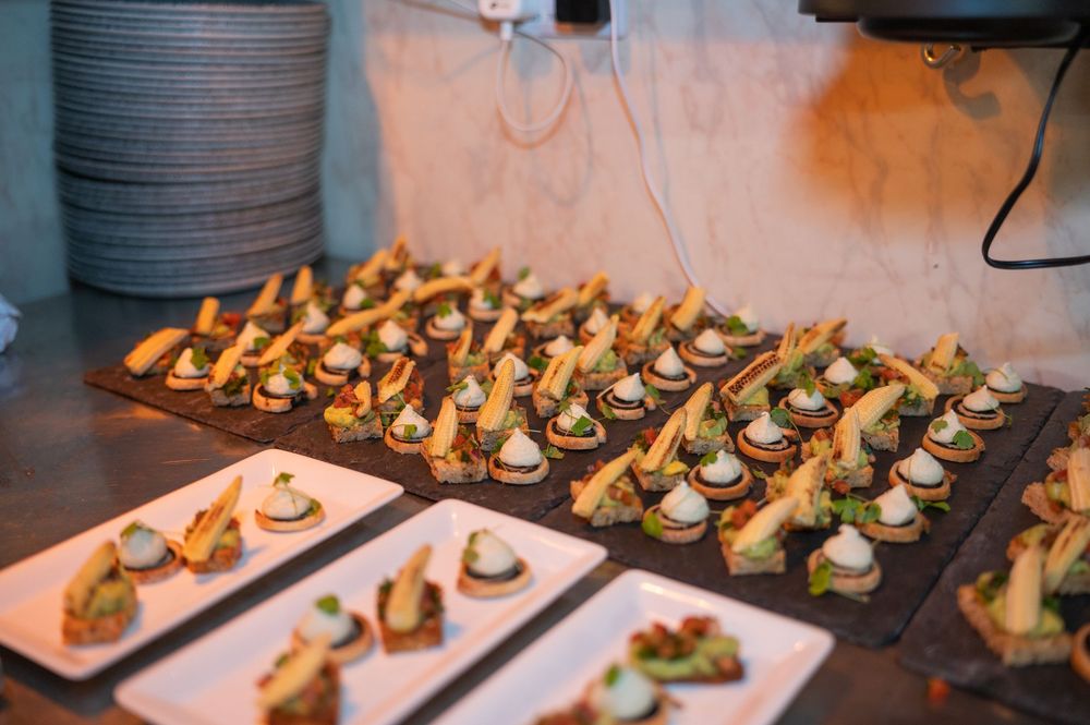 Elegant catering display of hors d'oeuvres arranged on white serving platters.