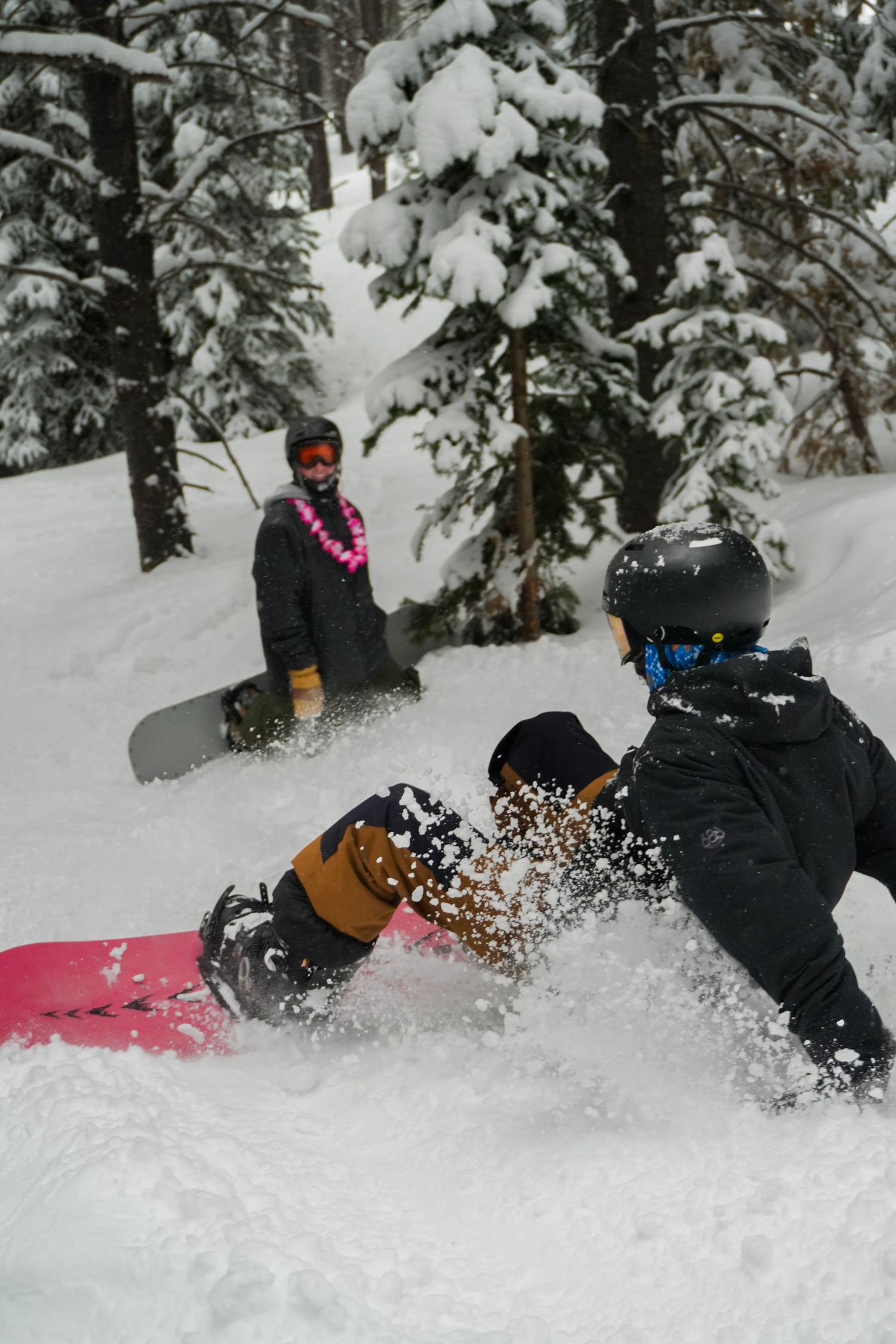 two snowboarders
