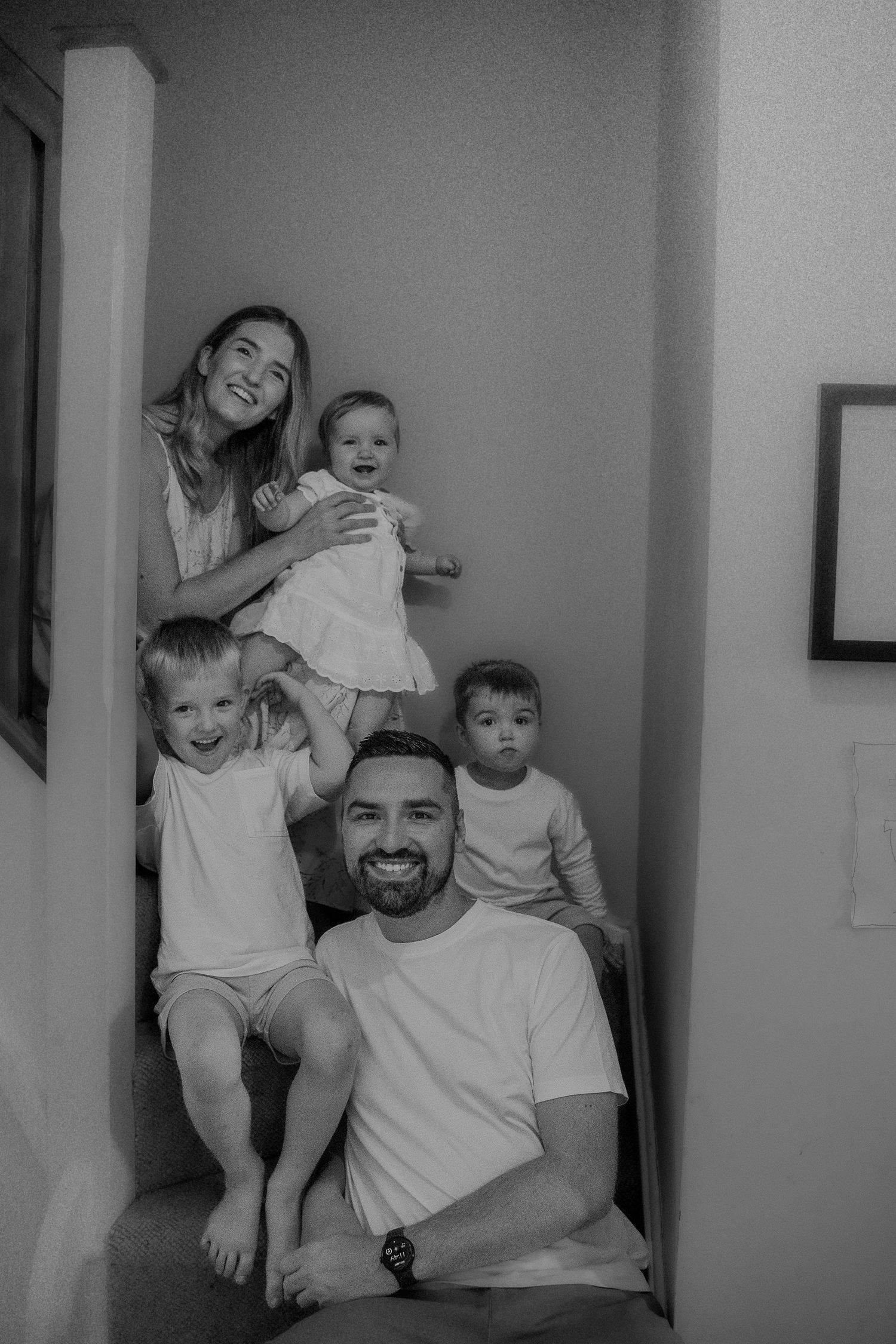 Candid family photo capturing morning light and real, messy moments at home