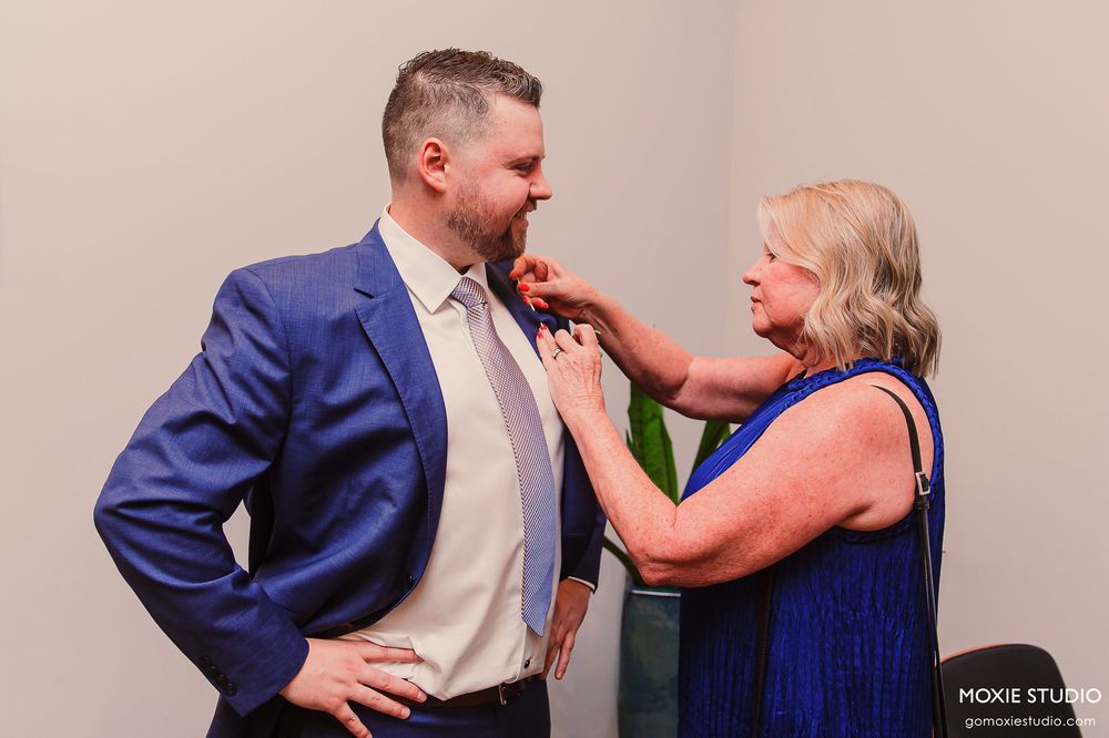 A couple in formal attire sharing an intimate moment in a photo sequence against a pink wall.