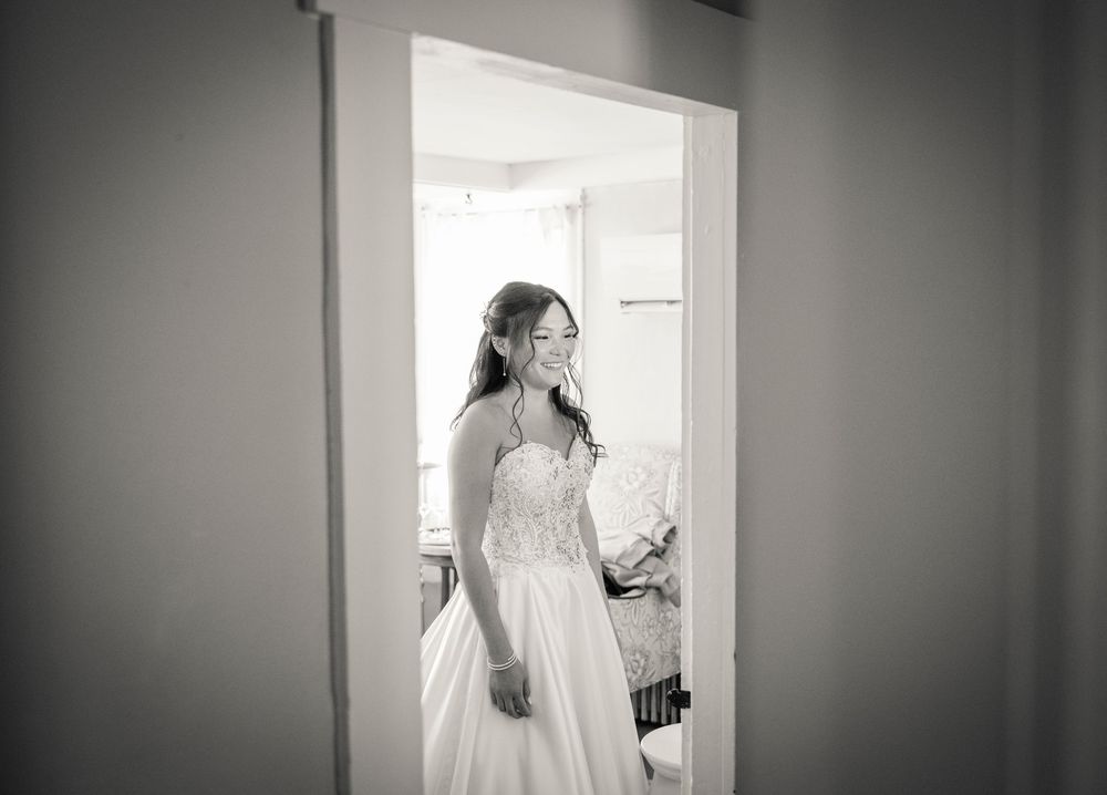 Black and white artistic wedding photography series showing doorway frames and natural window light.