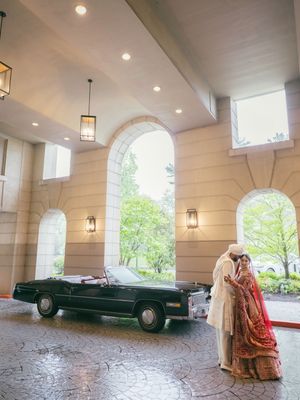 A series of photos showing a classic green vintage car and traditional wedding attire under an elegant arched portico.