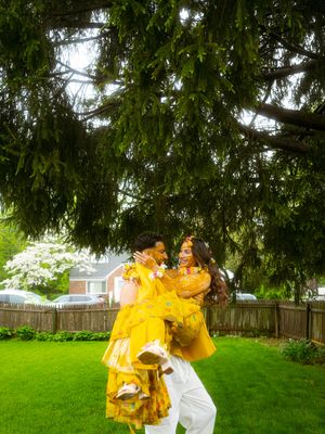 A sequence of photos showing two people in a backyard playfully throwing yellow powder during a color celebration.