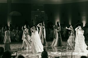 Black and white photo montage shows multiple couples dancing at an elegant formal event in a ballroom setting.