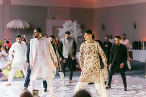 Fashion models walk the runway in designer outfits during a modern fashion show presentation.