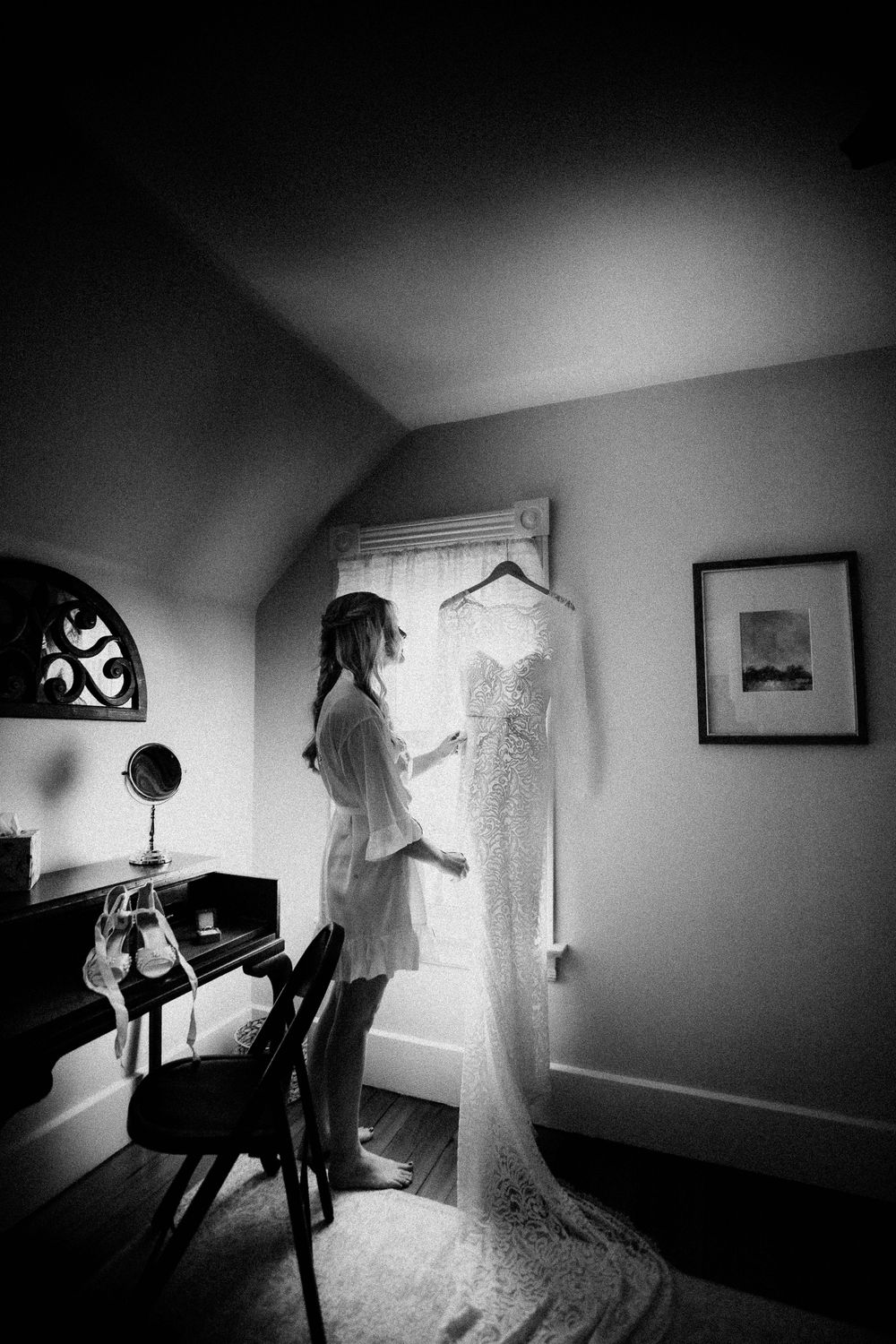 Black and white photos showing wedding dress preparations in a sunlit room.