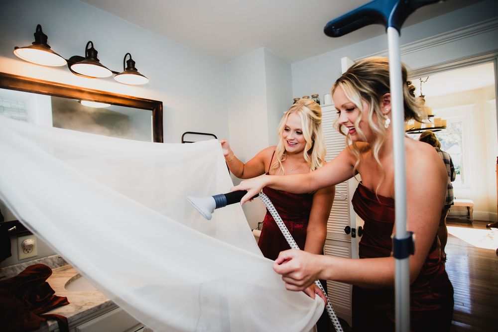 Wedding dress being steamed and prepared before the ceremony.