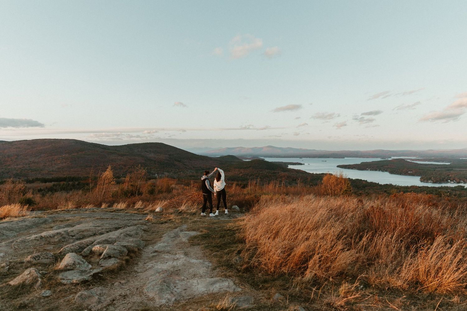 A scenic mountain landscape view with warm sunset lighting.