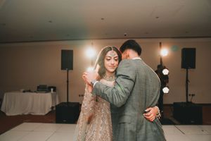 Couple sharing an intimate slow dance at their wedding reception.