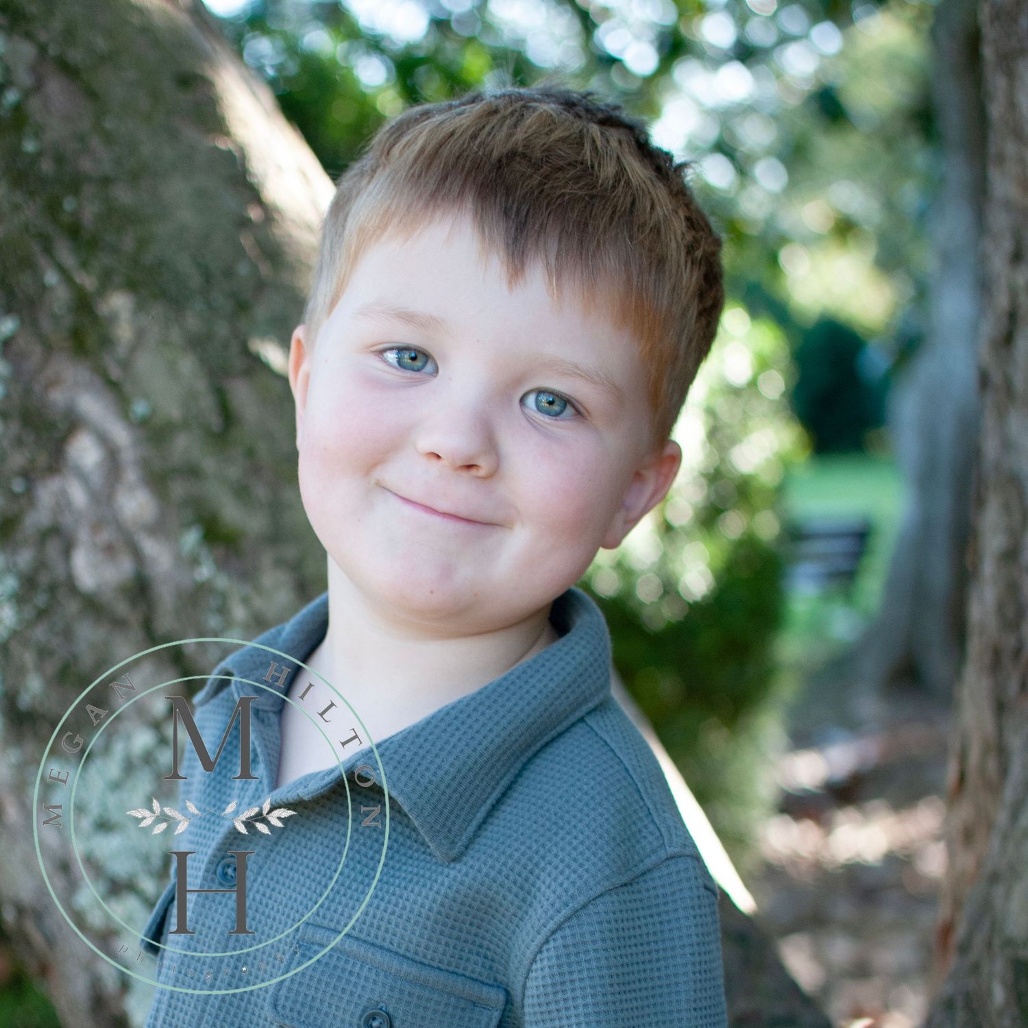 young boy photo near tree