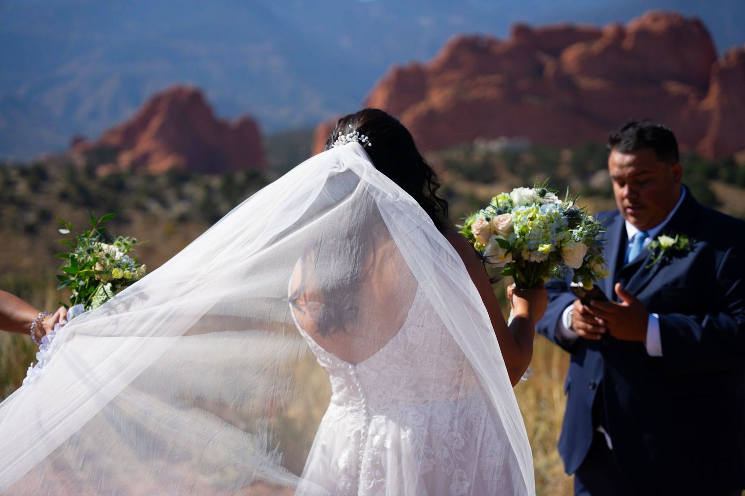Colorado Wedding Photography of Beautiful Bride and Veil in the Wind - Captured by KamaraImages