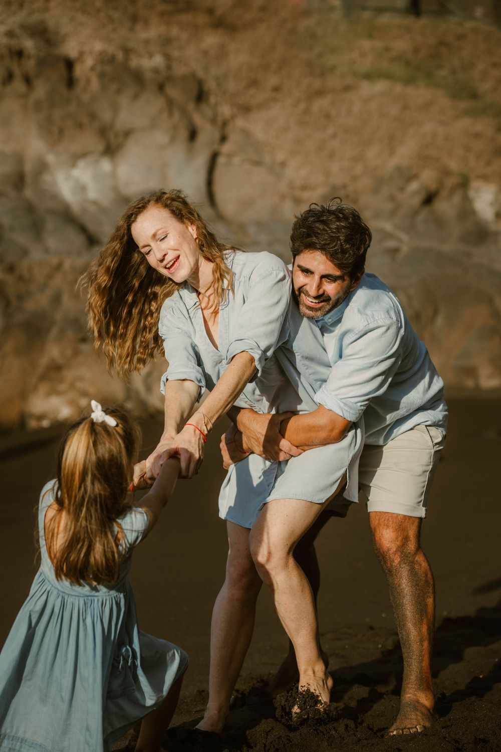 A heartwarming family photoshoot at Playa Bollullo, Tenerife, Canary Islands. Capturing joyful moments by the stunning ocean backdrop.