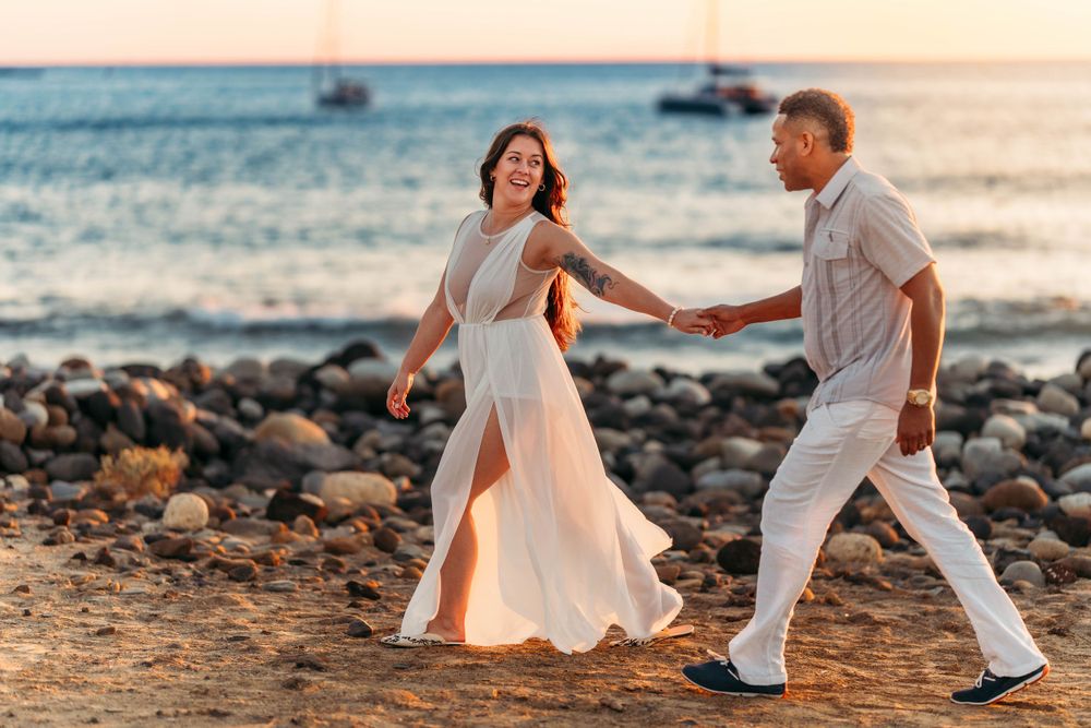 A romantic engagement photoshoot of a young couple in Los Cristianos, Tenerife, Canary Islands. Celebrating love by the ocean's edge.