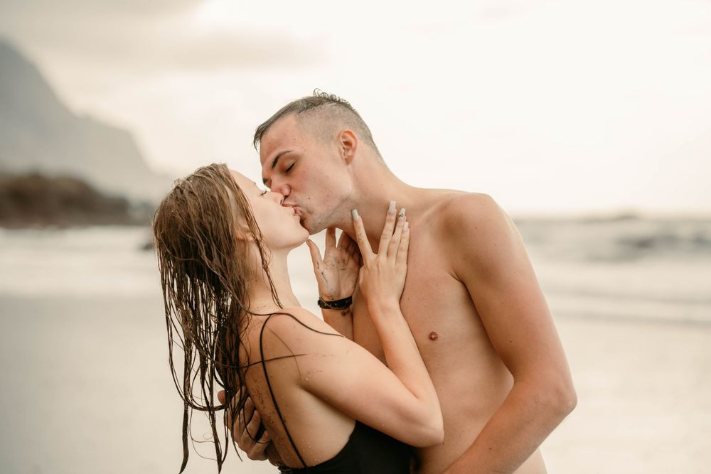 A romantic couples photoshoot at Playa del Roque de las Bodegas, Tenerife, Canary Islands. Capturing love amidst the rugged coastal beauty.