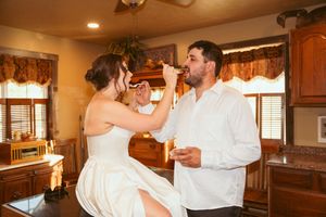 Romantic dance captured in a sunlit room with rustic interior design elements.