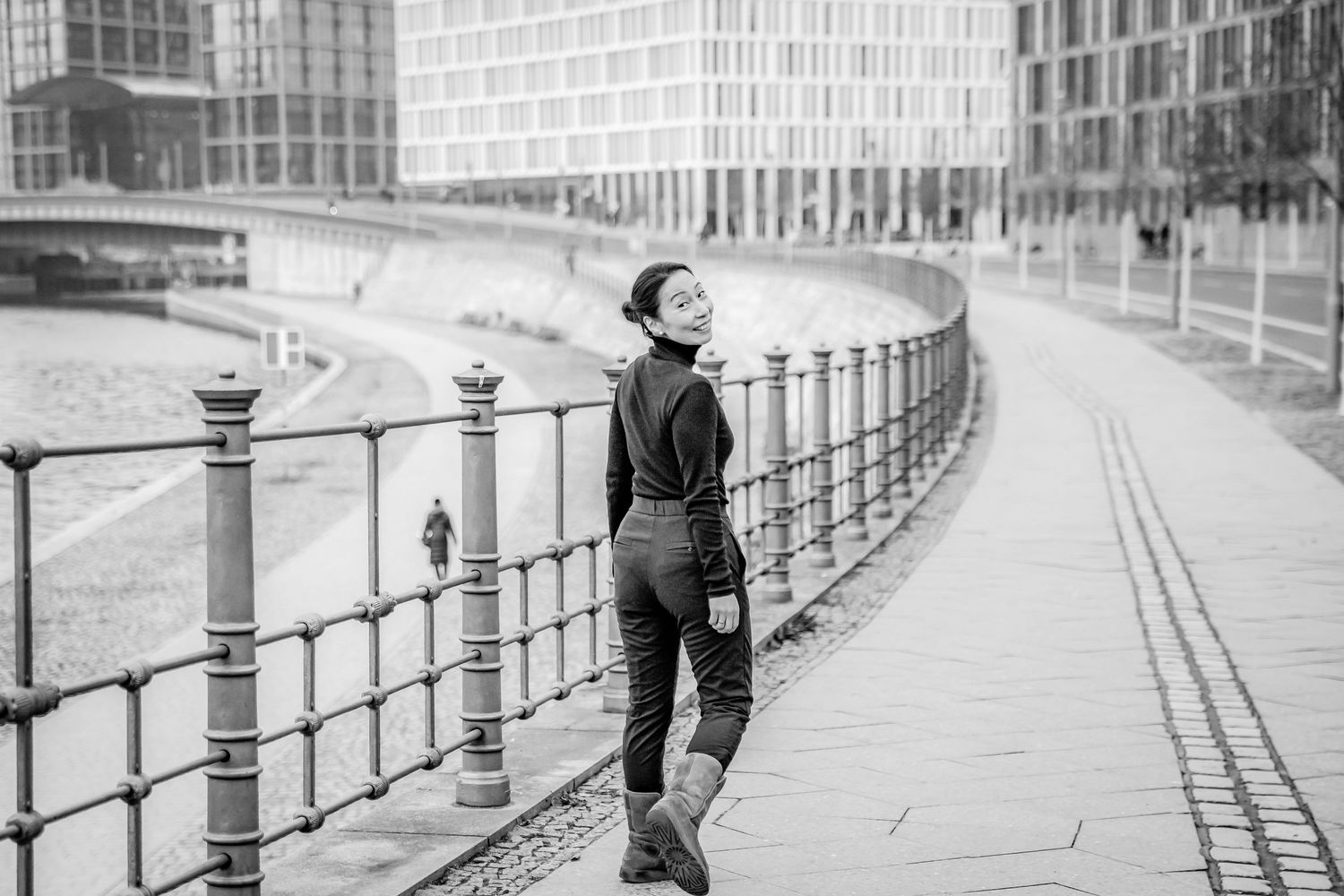 business branding portrait of female entrepreneur walking at Spree near main train station Berlin.