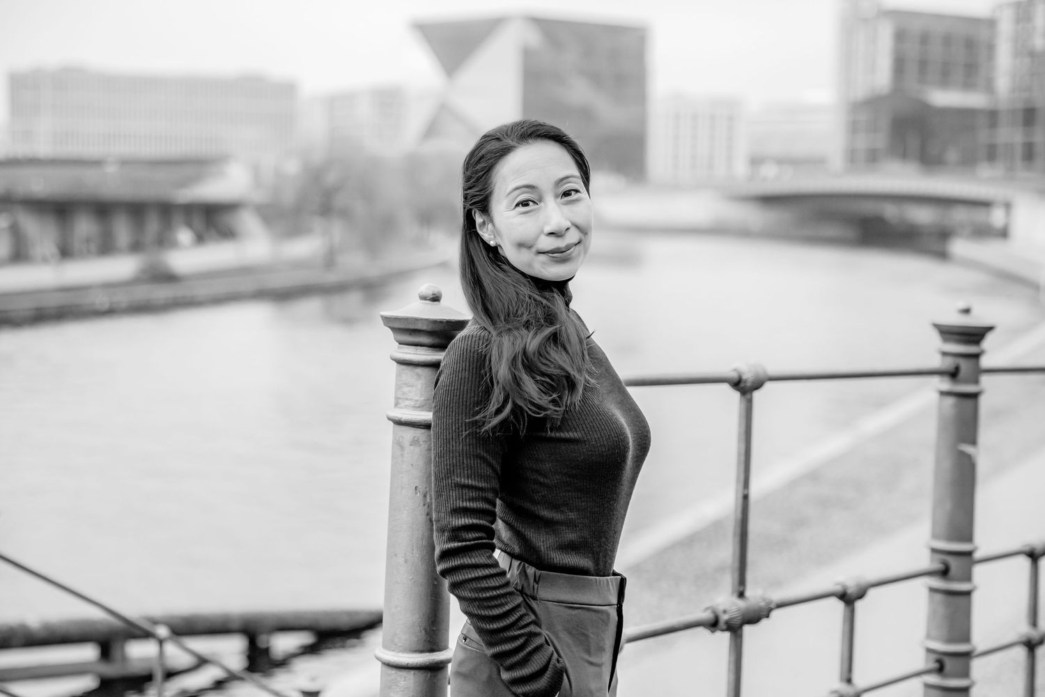 business branding portrait of female entrepreneur taking a walk at Spree near main train station Berlin.