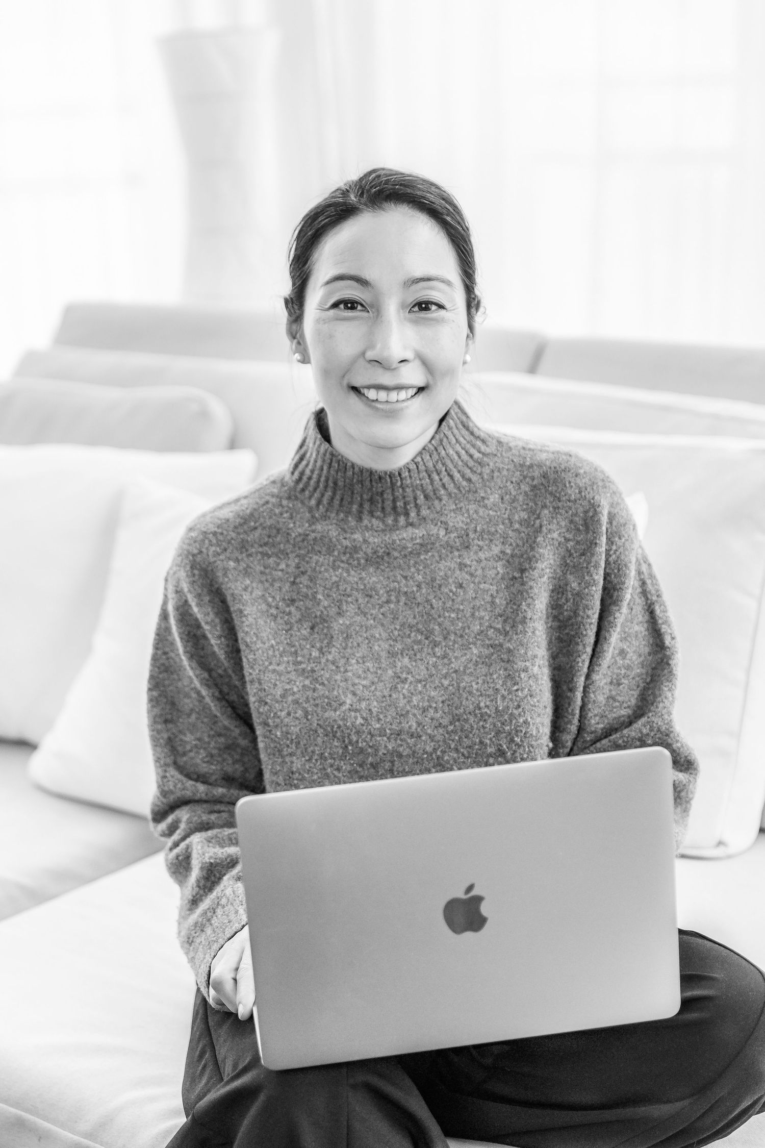 personal branding portrait of female entrepreneur working on laptop Berlin.