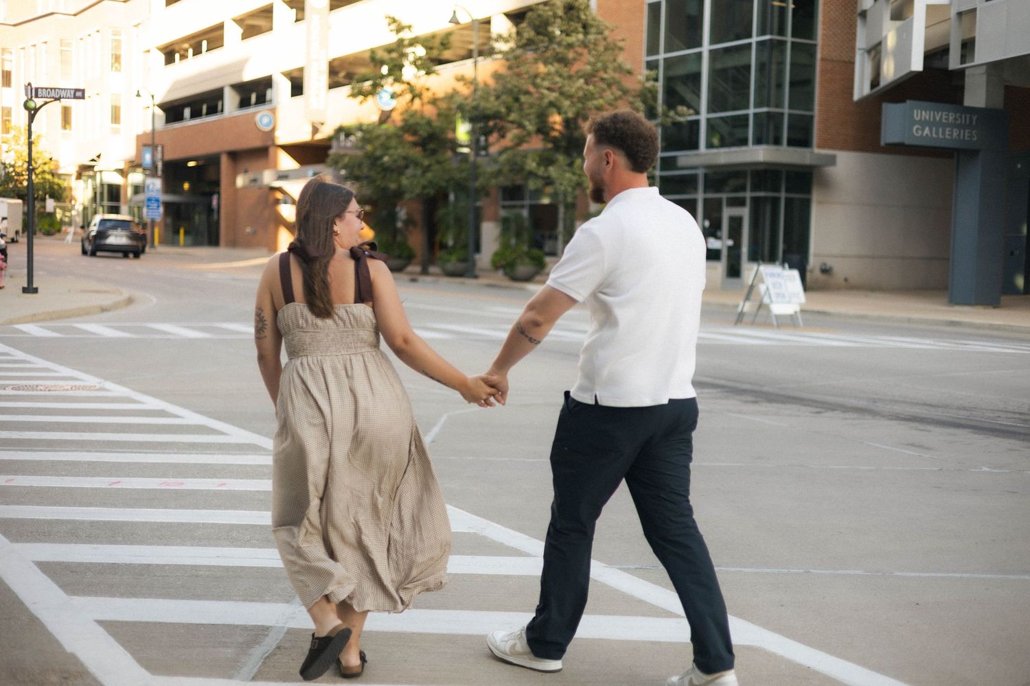 Outdoor uptown Normal summer engagement photos in Normal, Illinois
