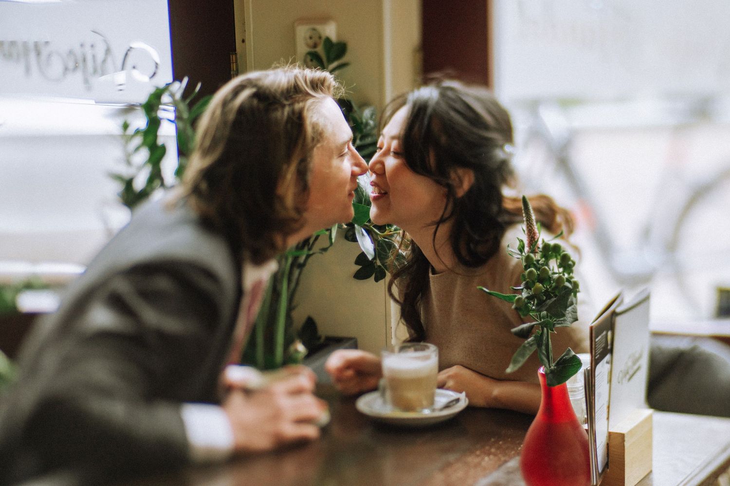 Intimate dining scene with soft lighting and festive holiday decorations.