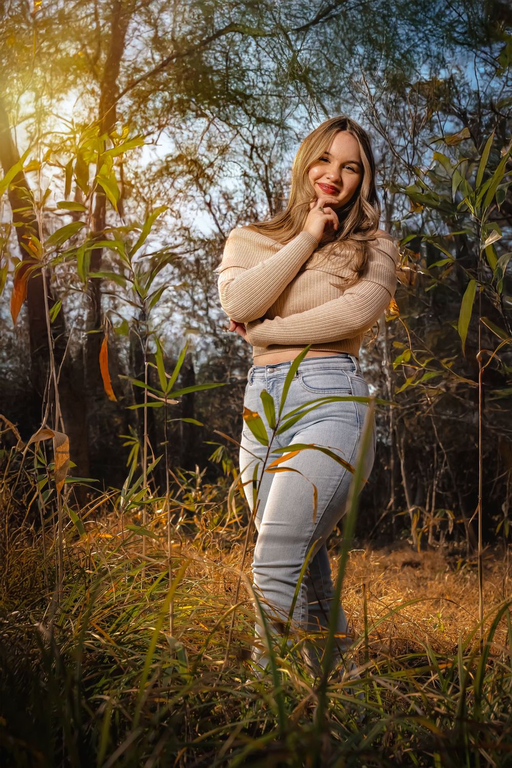 A series of outdoor portraits captured at golden hour among tall grass and trees with warm sunlight filtering through.