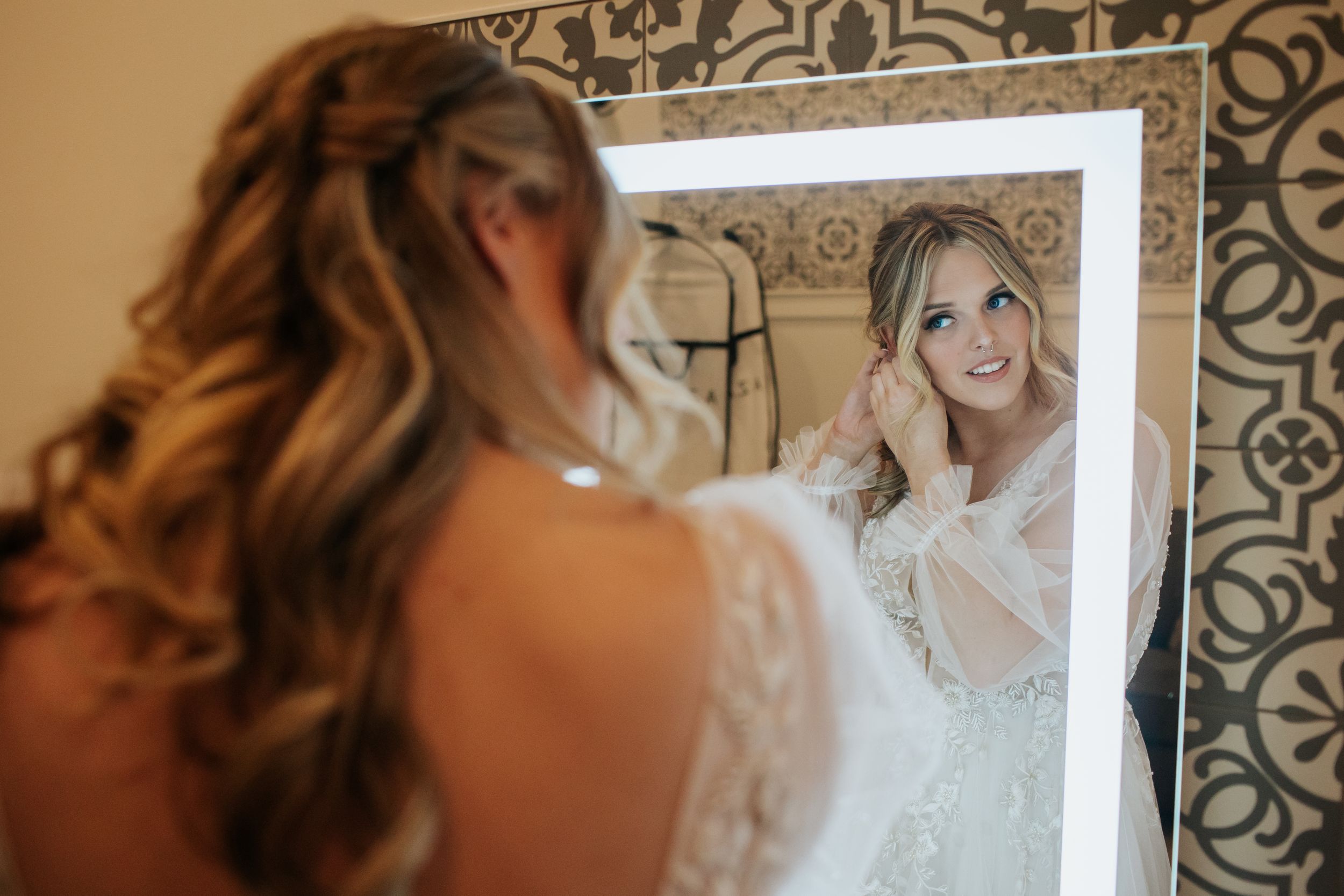 A series of romantic wedding photos showing a bride in a white dress from various angles in soft lighting.