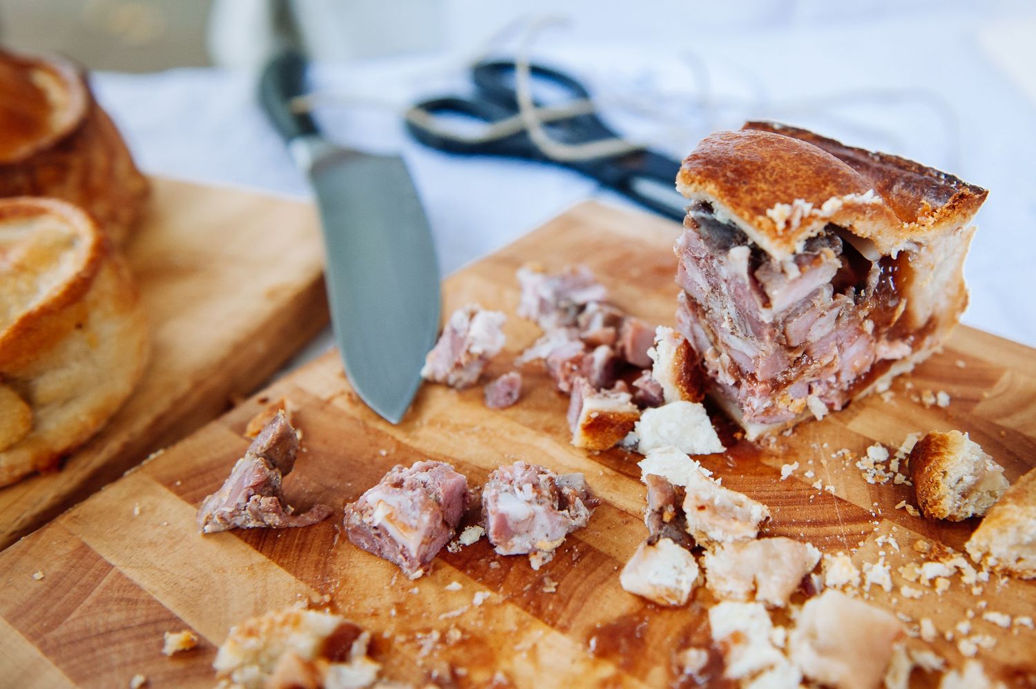 Sliced meat or charcuterie arranged on wooden cutting boards.