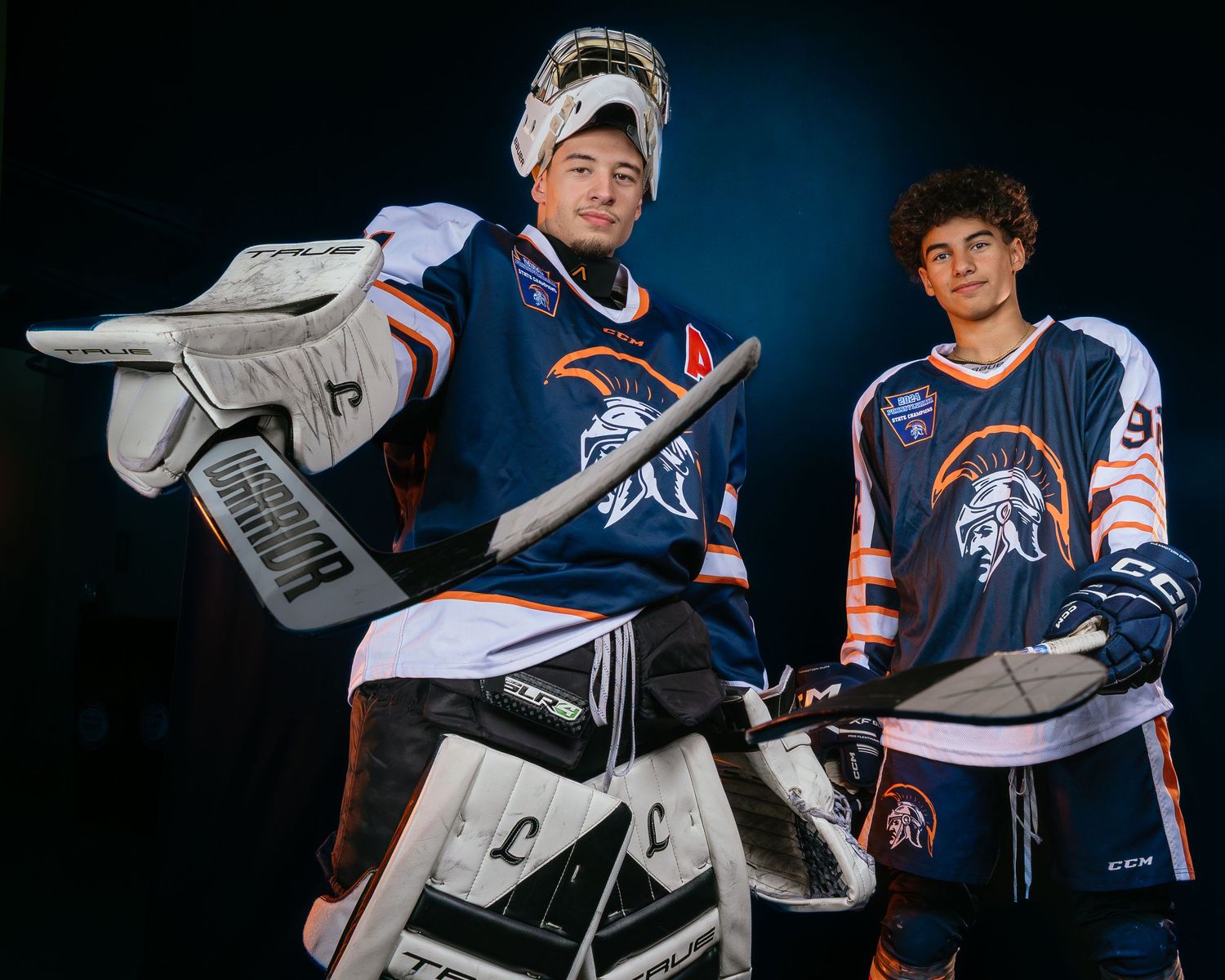 Dramatic media day portrait of a Hershey Trojans hockey goalie and skater siblings by Deanna Fox, SportsFox Photography, Hershey PA