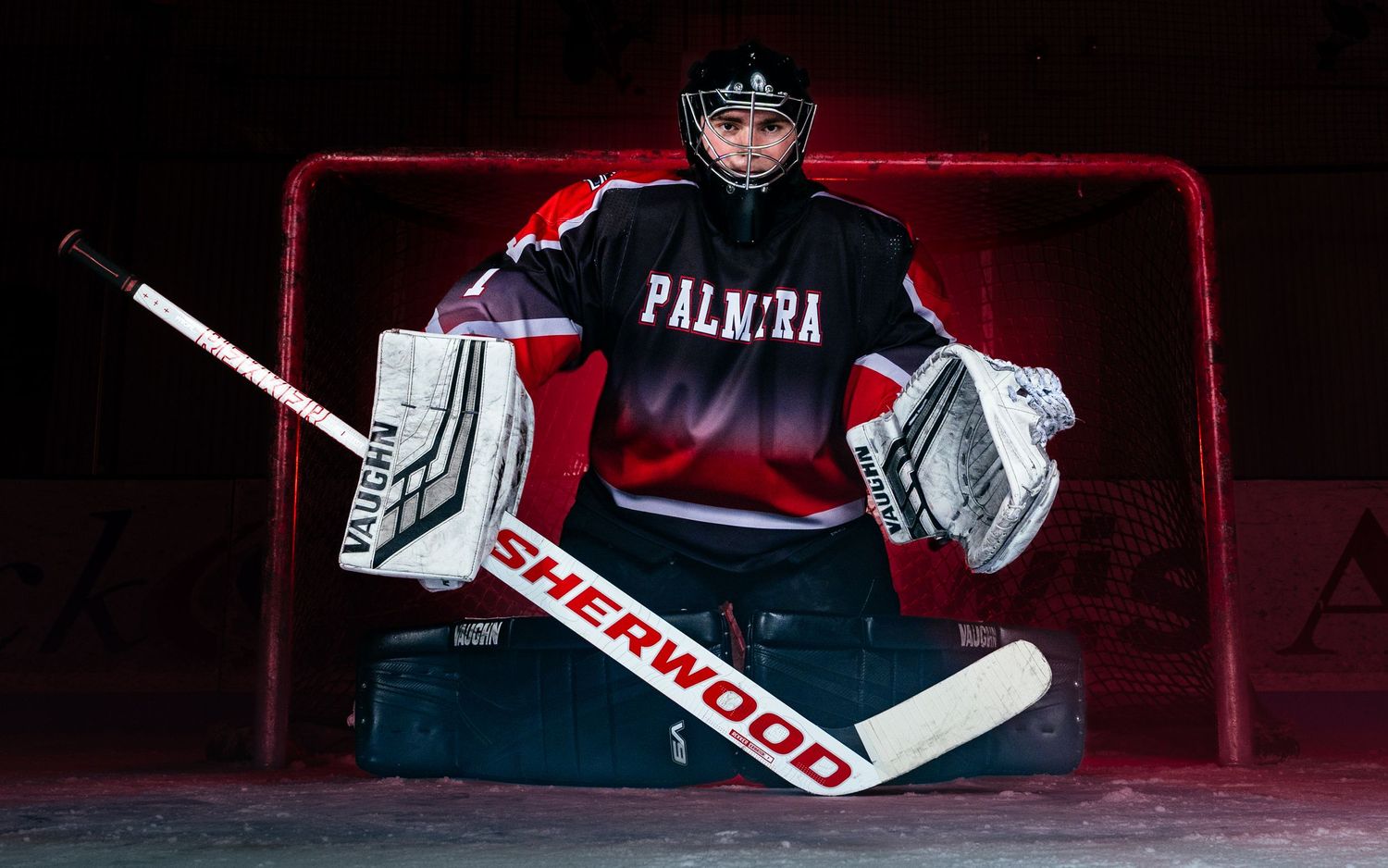 Palmyra Black Knights hockey player in red jersey, media day portrait, Palmyra Pennsylvania, by SportsFox Photography.
