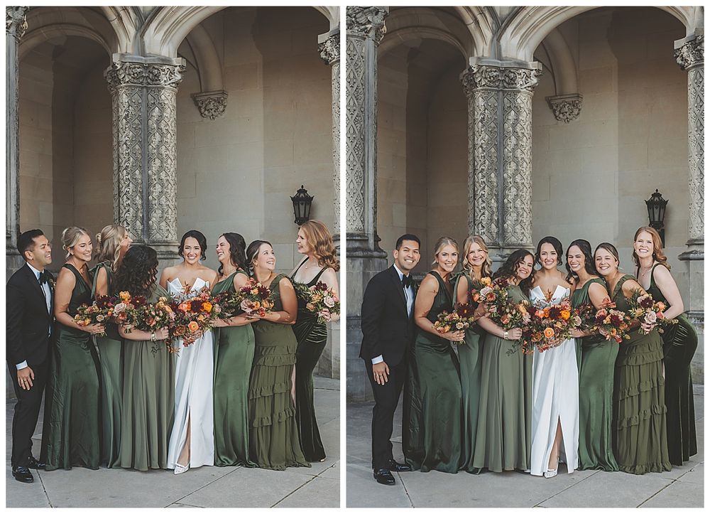 Wedding party in olive green dresses and white gowns poses together in an elegant stone archway.