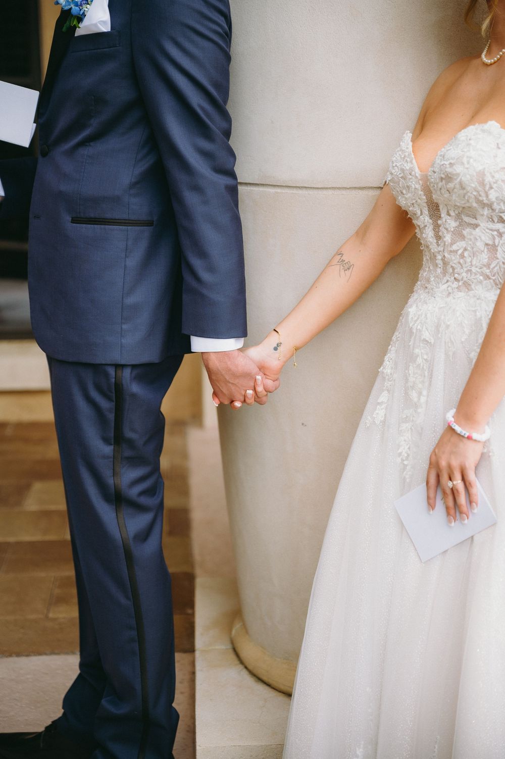 Detail shots of bride and groom's formal attire during wedding day first look.