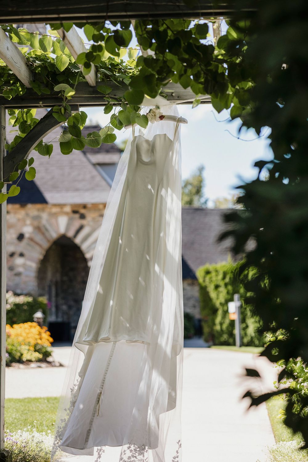 A wedding dress hanging in front of Castle Farms in Charlevoix Michigan