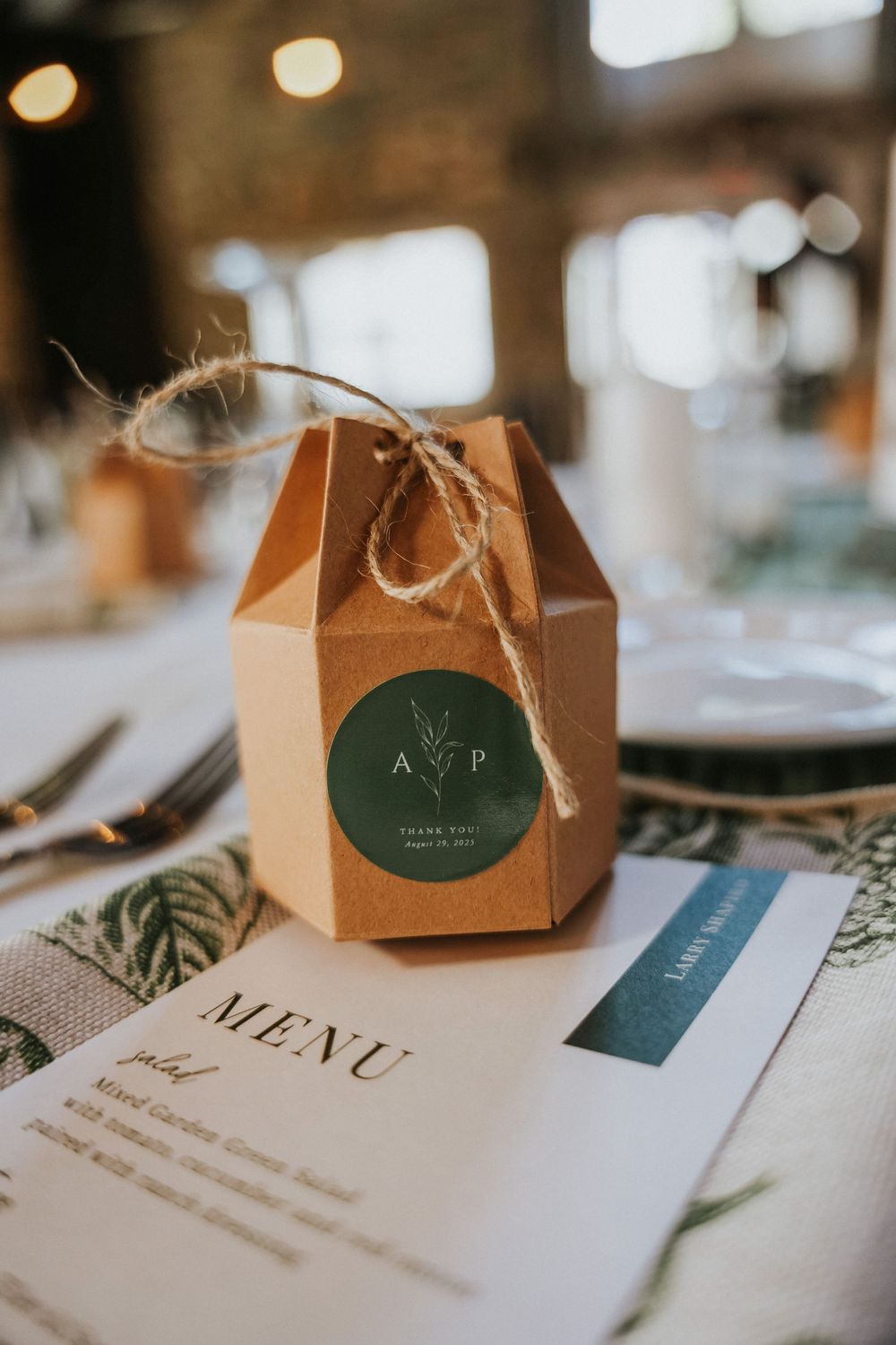 Guest gifts on each table tied with a rustic twine