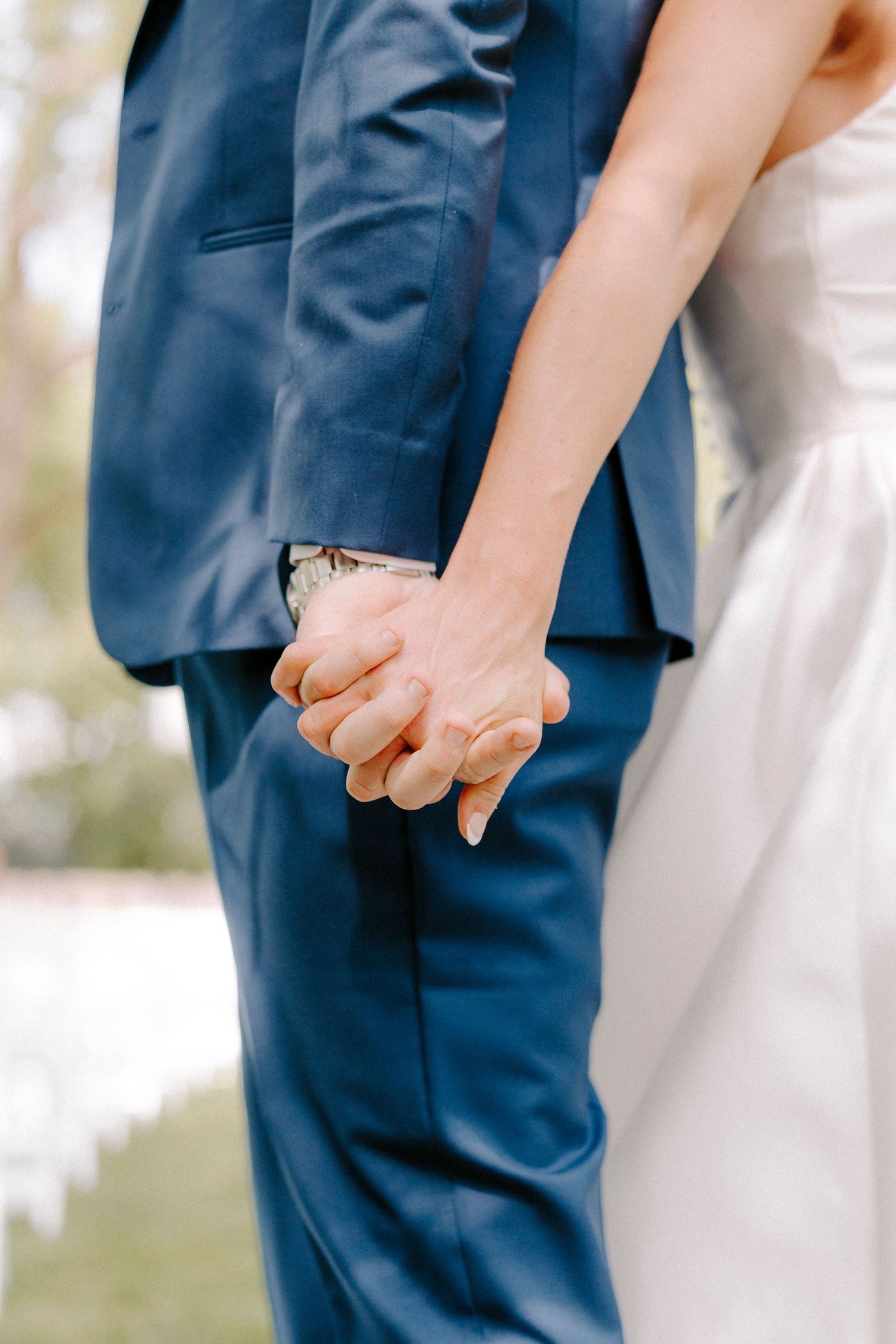 Close-up view of couple's hands holding each other at a wedding at The Ballroom at I-Street.